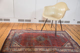 Decorative corner detail of the Mir Serbend rug, with time-softened red rust and blue mirror border.