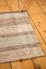 Upcycled hand-woven Scandinavian rag rug with antique ivory and beige stripes, light tatter.