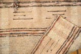 Hand woven texture of antique ivory and charcoal blue striped Scandinavian rag rug with secured edge.