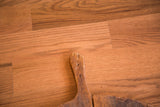 Vintage pizza board's rustic wooden handle, showing aged texture and natural patina.