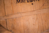 Rustic wood grain and horizontal brace on vintage pizza board with partial 'Marb' stamp.