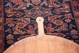 Vintage wooden pizza serving board, featuring rustic patina and wood grain.
