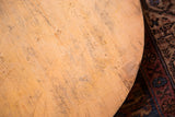 Textured surface of the vintage wooden pizza board with natural grain and rich patina.