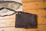 Rugged vintage dark brown leather messenger bag with a front flap and buckle strap.