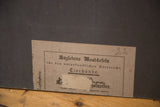 Detail of vintage Polish school chart's German text label, showing script and handwritten '22'.