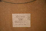 Back of vintage school chart with German animal identification label on aged cardboard.