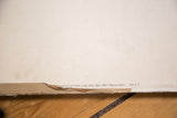 Bottom edge of vintage Polish school chart with printed text and paper wear.