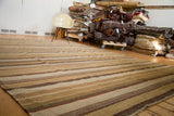 Hand woven New Kilim Carpet with horizontal stripes in muted yellow, brown, and ivory.