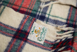 St. Moritz Carlyle 100% wool label and fringe on vintage plaid blanket.