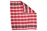 Vintage plaid wool blanket featuring red, white, green, blue checks and red satin edging.