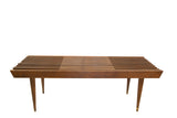 MCM vintage expandable slat bench in brown wood with tapered legs.