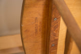 Detail showing 'Made in Denmark' and 'N.F.C.104' stamped on vintage teak.