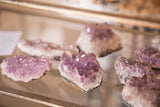Vibrant purple amethyst crystal cluster displaying sparkling facets.