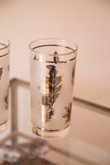 Frosted Mid Century glassware featuring silver fall leaf design with golden reflections.