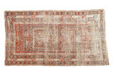 Antique Distressed Caucasian rug with intricate geometric medallions and muted jewel tones, 3'5