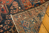 Distressed vintage Bakhtiari carpet pile, hand-knotted reverse, and fringe.