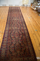 Textured distressed Bijar runner, highlighting sculpted Herati pattern in cherry and indigo.