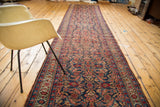 Distressed Vintage Bijar runner detail showcasing faded Herati floral patterns in cherry and indigo.