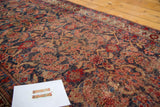 Textured detail of distressed Bijar runner, revealing cherry red and indigo Herati design.