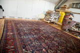 Distressed Mahal carpet with rich indigo guli-hinnai field and black cherry border.