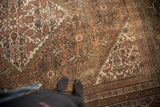 Faded Herati pattern in peach, blue, ivory, showcasing distressed texture.