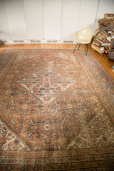 Antique Distressed Mahal carpet with faded peach, blue, ivory diamond medallion and Herati pattern.