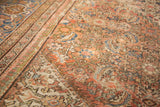 Distressed antique Mahal carpet with faded peach, blue Herati design, geometric border.