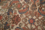 Textured Herati pattern with faded peach, blue, ivory on an Antique Mahal carpet.