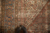 Antique Persian Mahal border detail: faded blue turtle motif and distressed Herati field.
