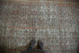 Antique Distressed Doroksh gallery runner displaying intricate, time-softened design.