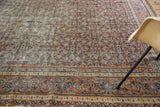 Finely woven, distressed antique Doroksh runner with intricate rust, navy, and ivory patterns.