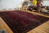 Distressed plum field with classic floral bouquet patterns and dark navy border.