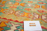Unusual aqua blue and orange reciprocating motifs on the Vintage Murat runner's thick pile.