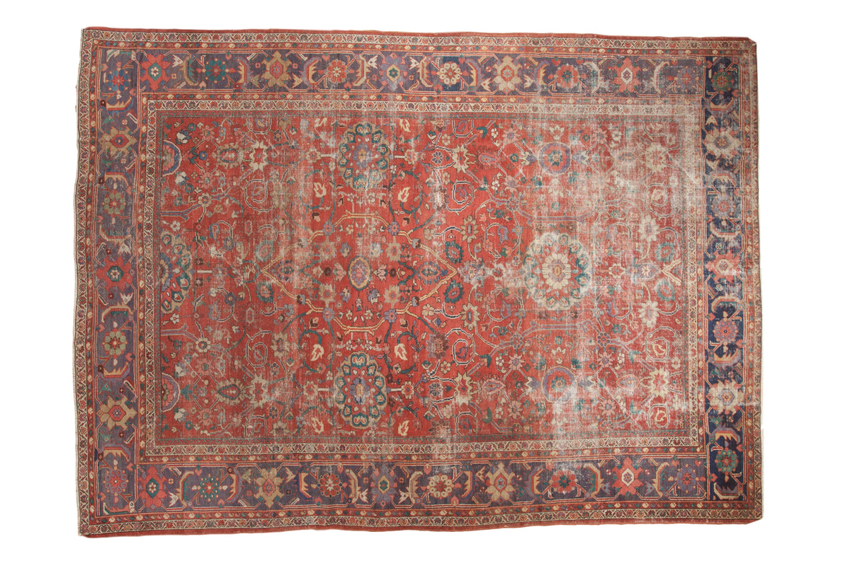 Antique Sultanabad carpet with unique coral-red field, lavender-purple border, distressed, 8'5" x 11'8".