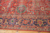 Coral-red field and unique lavender-purple border on antique Sultanabad carpet, showing distress.