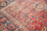 Antique Sultanabad carpet detail: distressed coral-red field, worn to knot heads, with lavender-purple border.