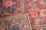 Distressed coral-red field and lavender border, with visible foundation on this antique Sultanabad.