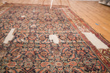 Antique Fereghan carpet with rich Herati pattern, exposing areas of restored plain weave foundation.