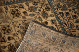 Antique Farahan Sarouk rug folded, displaying its fine hand-knotted reverse and delicate tendrils.