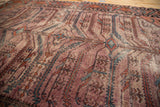 Antique Distressed Lilihan rug surface with pronounced serrated motifs in textural mauve.