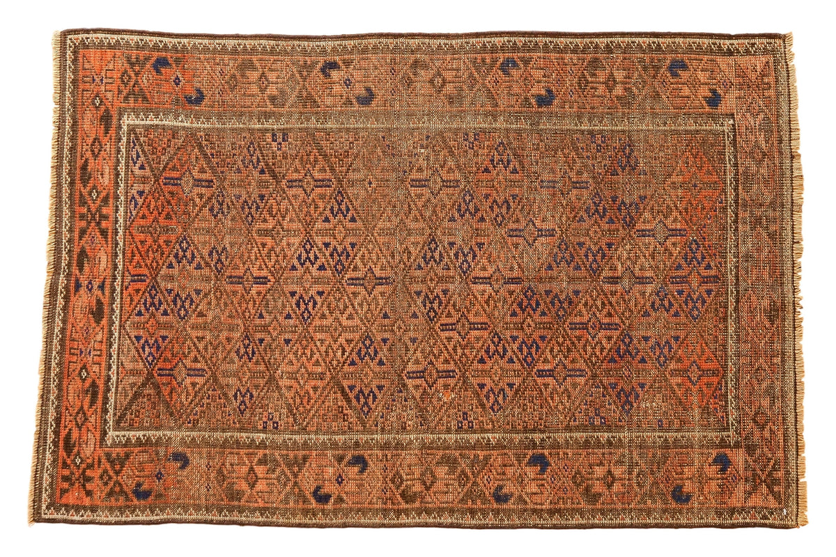 Distressed Belouch rug, allover diamond gul design in madder red, copper, navy, 2'7" x 4'.