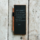 Reclaimed black leather pencil holder with white Koh-I-Noor chalk pencil on tablet.