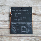 Reclaimed handheld chalkboard pad, white chalk garden plan, brown leather pencil holder, 9.5 by 7.5 inches.
