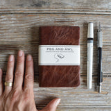 Heirloom nutmeg reclaimed leather journal with Peg and Awl label.