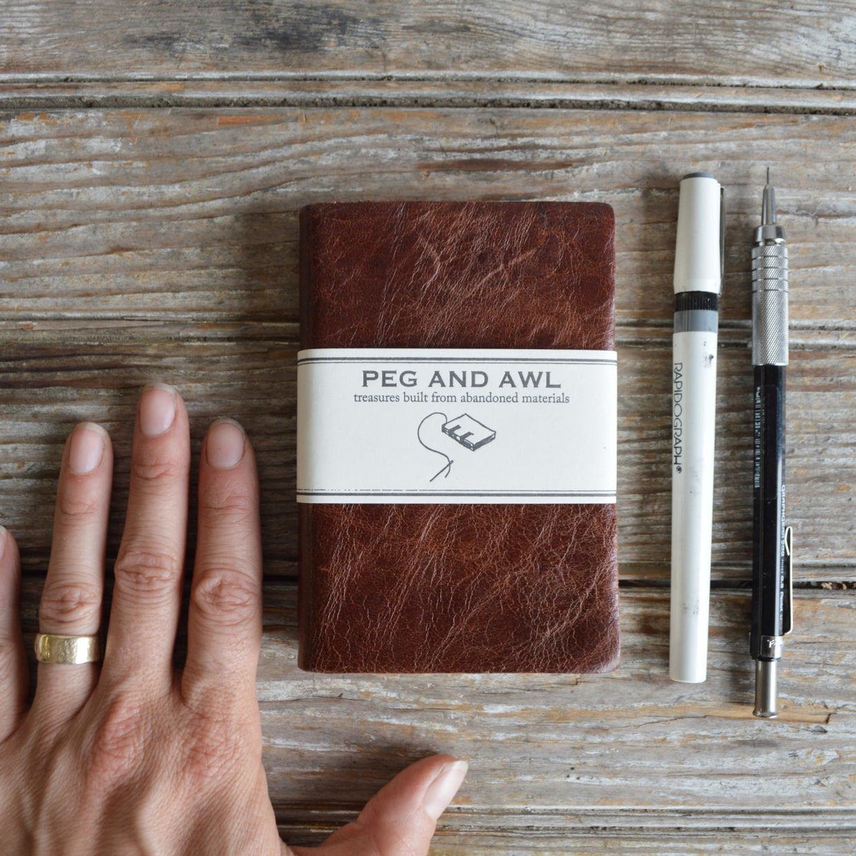 Heirloom nutmeg reclaimed leather journal with Peg and Awl label.