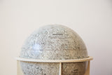 Collectible 1960s Moon Globe with detailed textured craters and text branding.