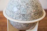 Vintage moon globe close-up of Mare Tranquillitatis and Apollo 11 landing site.