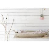 Fair Trade Long Basket Tray, woven natural seagrass with integrated handles, holding a light pink textile.