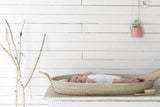 Fair Trade long basket tray used as a changing station for a baby.