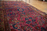 Hand-knotted Persian Merhaban rug detail: raspberry field, navy florals, white knots, circa 1930s.